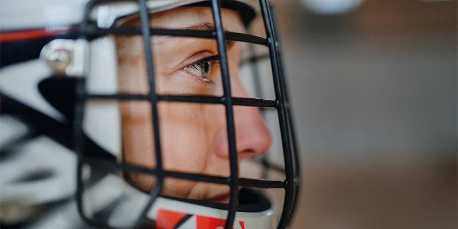 Close up of woman in headgear concetrating on game