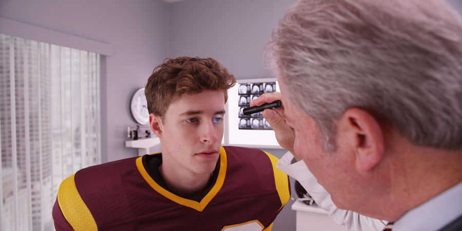 Optometrist examining eyes